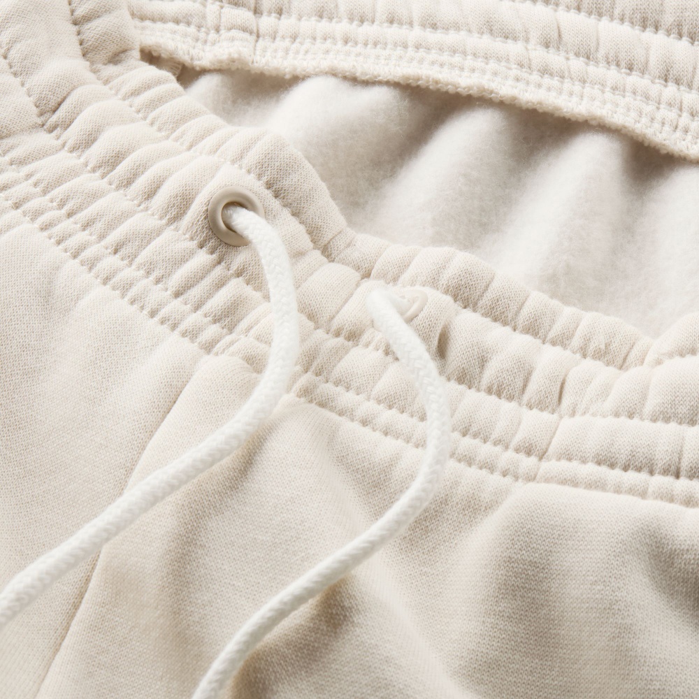 Штани Nike NSPHNX FLC MR STD LOGO PNT HM9757-104 р. S бежевий