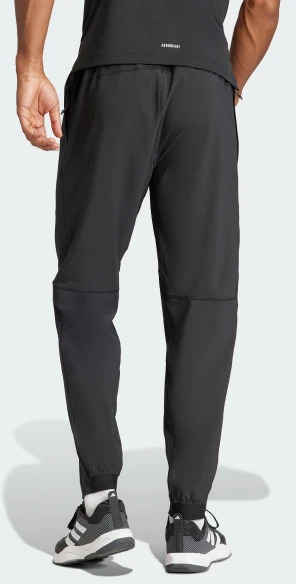 Брюки Adidas TR-ES WOVEN PT IT5457 р. 2XL черный