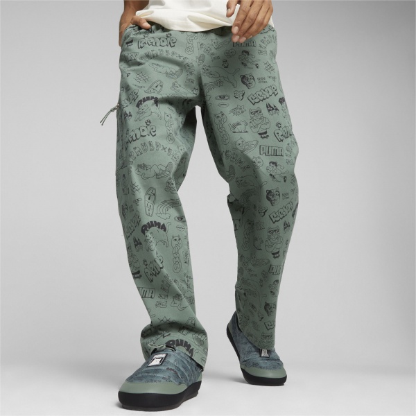 Брюки Puma PUMA X RIPNDIP AOP TWILL PANTS 62220044 р. M зеленый