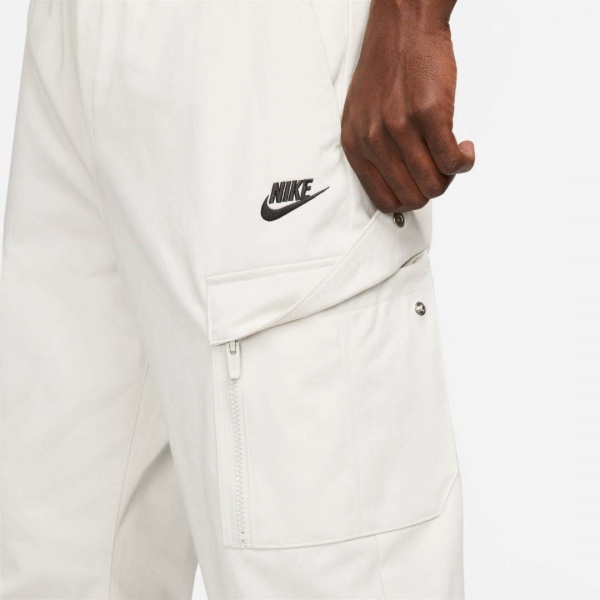 Брюки Nike M NSW SPU WVN PANT FD4336-072 р. L разноцветный