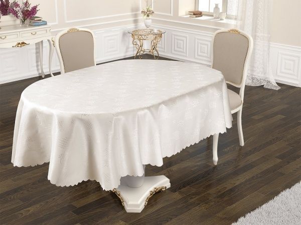 Скатерть Dertsiz овальная 160x220 см кремовый Karna 