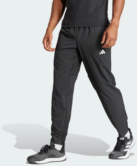 Брюки Adidas TR-ES WOVEN PT IT5457 р. S черный