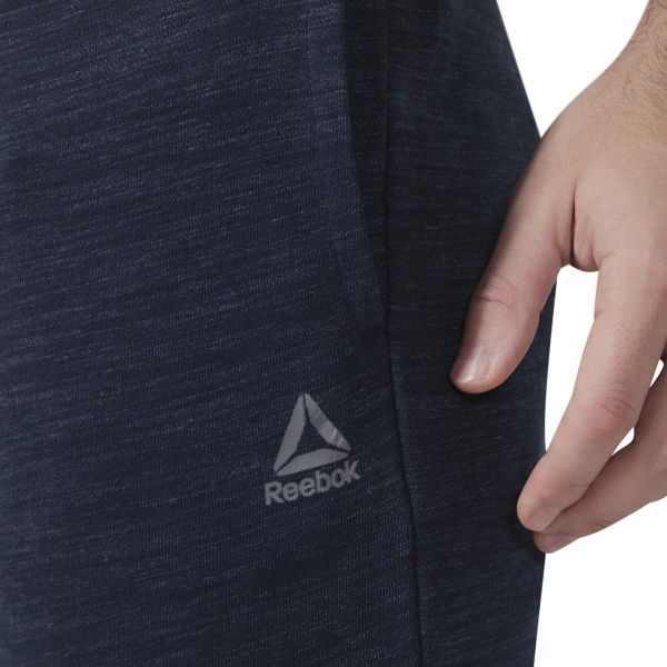 Брюки Reebok TE MARBLE GROUP JOG DU3782 р. S темно-синий