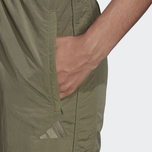Штани Adidas W woven pant FI6718 р. S зелений