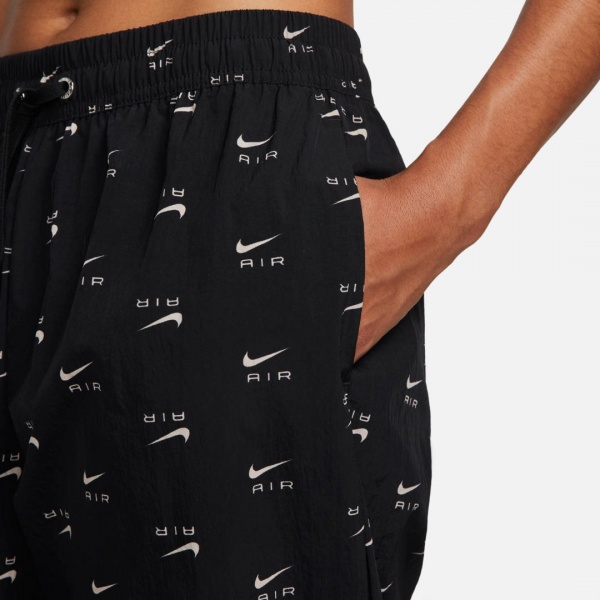 Штани Nike W NSW AIR AOP WVN MR PNT DV8058-010 р. M чорний