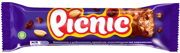 Батончик Picnic з карамельною начинкою арахісом хрусткими пшеничними пластівцями родзинками покрита молочним шоколадом