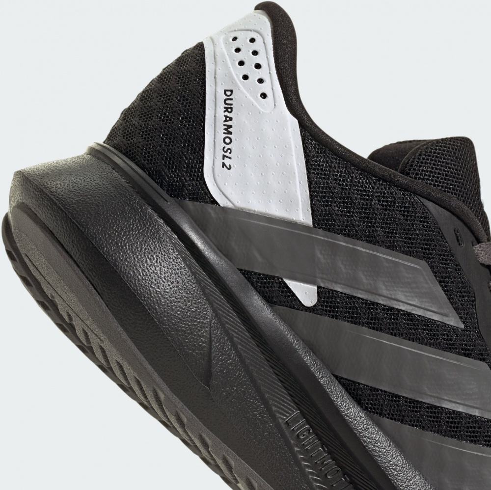 Кросівки унісекс весняні Adidas DURAMO SL2 J CBLACK/GREFIV/FTWWHT JS2369 р.37 1/3 чорні