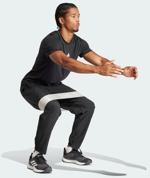 Брюки Adidas TR-ES WOVEN PT IT5457 р. 2XL черный