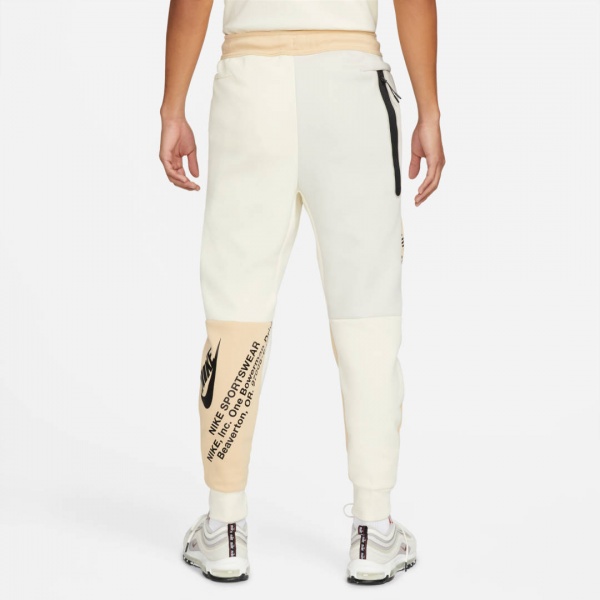 Штани Nike DM6480-252 р. L бежевий