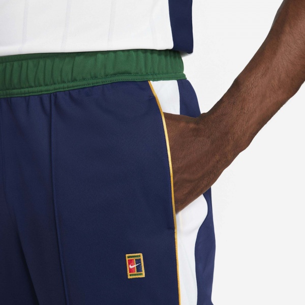 Штани Nike M NKCT HERITAGE SUIT PANT DC0621-429 р. S фіолетовий