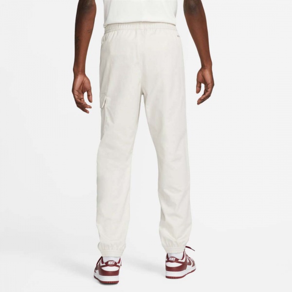 Брюки Nike M NSW SPU WVN PANT FD4336-072 р. XL разноцветный