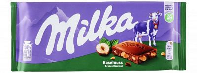 Молочний шоколад Milka молочний з подрібненим лісовим горіхом м/у 100г